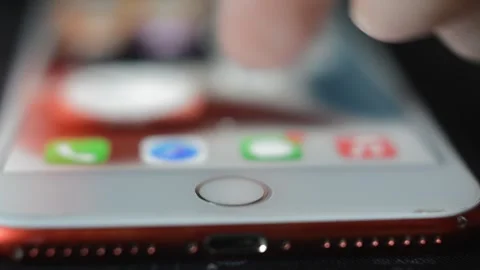 Iphone device with apple icon logo in a dark blur background. 스톡 동영상 254067157