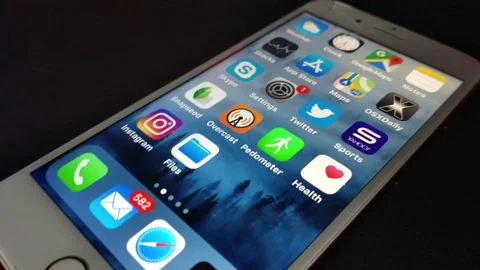 Iphone display screen. camera movement on the display with icon and app. Stock Footage 236357249