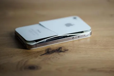 Iphone with exploded Lithium-ion battery. Li-ion swollen battery Stock Photos