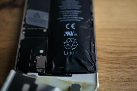 Iphone with exploded Lithium-ion battery. Li-ion swollen battery Stock Photos