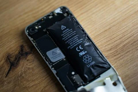 Iphone with exploded Lithium-ion battery. Li-ion swollen battery Stock Photos