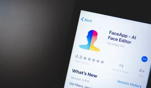 IPhone with Face App logo on the screen. Stock Photos