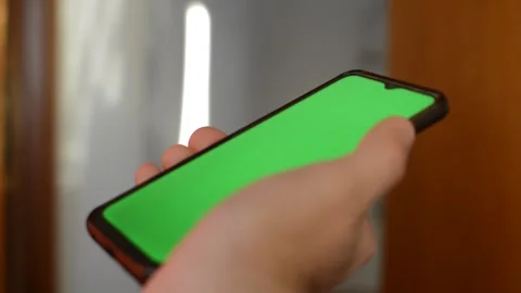 Iphone green screen in blur background. young man use iphone. Stock Footage 263138299