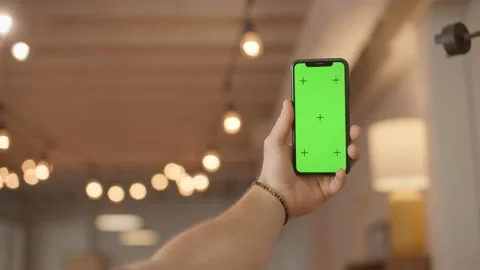 Iphone green screen mockup, holding phone with trendy lights Stock Footage 218467021