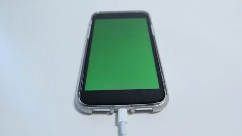 IPhone Greenscreen Connected to Charging Cable in Frame 動画素材 127727036