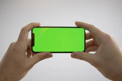 IPhone in hand Stock Photos