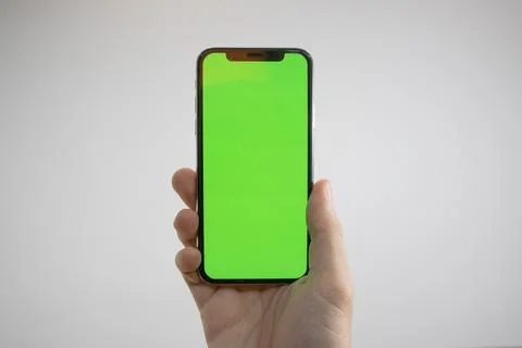 IPhone in hand Stock Photos