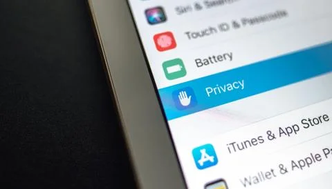 IPhone interface and privacy section on the screen. Stock Photos