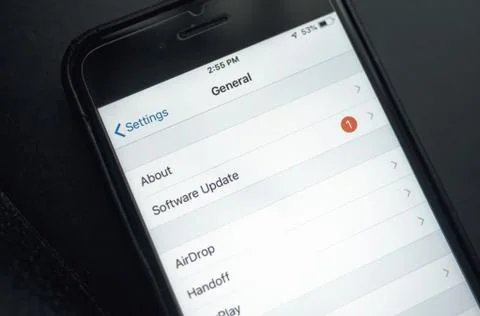 IPhone interface and software update selection on the screen. New update iOS Stock Photos