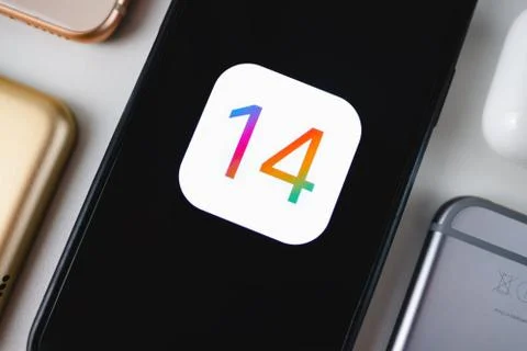 IPhone with iOS 14 logo on the screen. Stock Photos