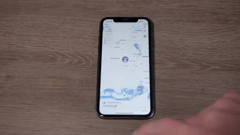 IPhone with IOS 16 opening weather app, Medium Stock Footage 217767485