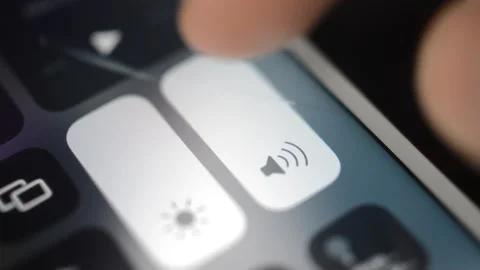 Iphone mute. man turn off the volume of the iphone smartphone. Stock Footage 234193112