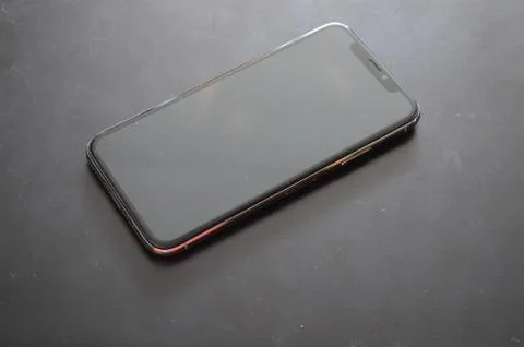IPhone phone is on a dark background Stock Photos