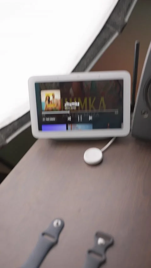 An iphone pixel phone iPad MacBook and google nest hub on a workstation Stock Footage 234708211