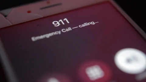 Iphone screen with 911 emergency number call. 911 technology. 動画素材 238783583