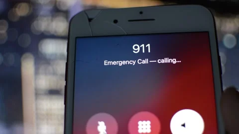 Iphone screen with 911 emergency number on the display in a night city. Vídeo Stock 238784224