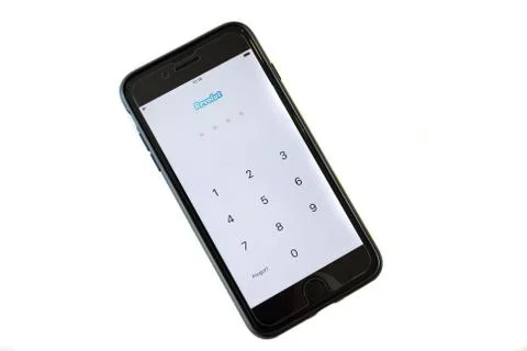 An iphone with the screen showing the log in page Stock Photos
