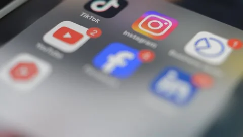 Iphone screen with social network app icon on display. Video stock 274131137