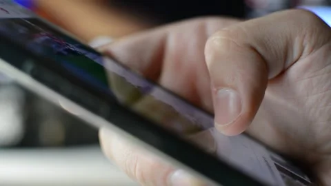Iphone scroll in blur background. apple iphone device scroll on social network. Stock Footage 286977511