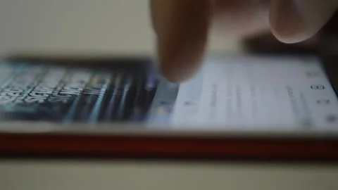 Iphone scroll. man's hand scroll instagram social network on iphone screen. 스톡 동영상 234184922