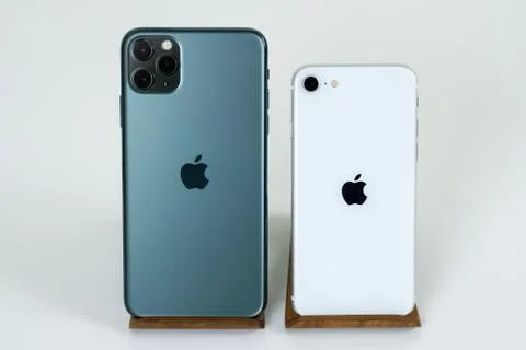 IPhone SE 2020 (2nd Generation) and iPhone 11 Pro Max in midnight green. Stock Photos