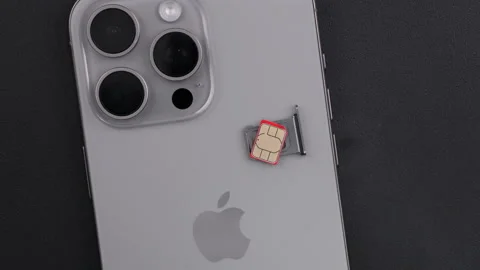 IPhone with SIM Card and Tray on Dark Background Stock Footage 336476028