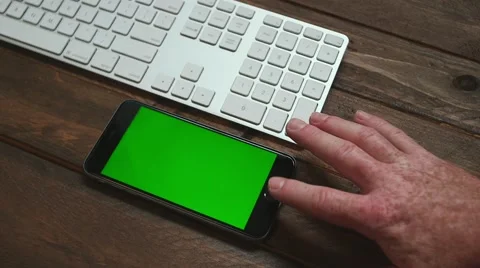 Iphone six on desk with keyboard Видео 64048370