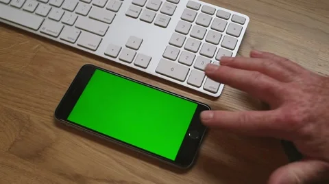 Iphone six on desk with keyboard Видео 64048513