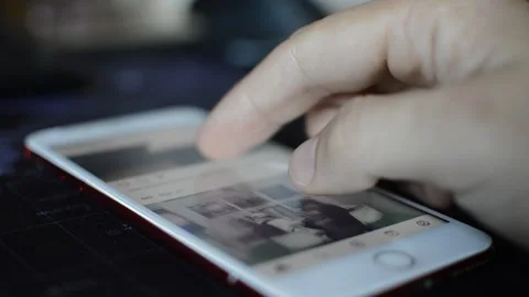 Iphone social. caucasian man scroll instagram social on iphone display. Stock Footage 240312258