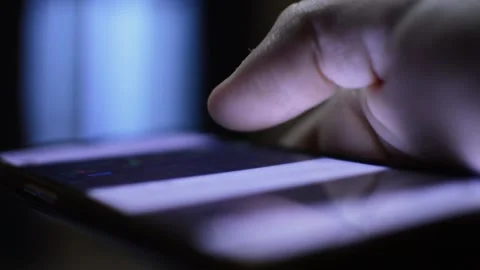 Iphone telecommunication concept. man's hand use iphone in the dark night. Stock Footage 230149497