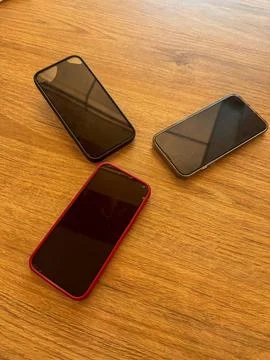IPhone-type cell phone on a table Foto stock