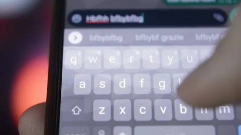 Iphone typing in city blur background. man type on iphone in night. 스톡 동영상 232116688