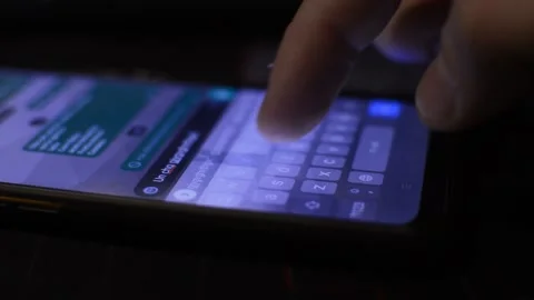 Iphone typing in night. young man type on the mobile phone keyboard in night. Stock-Footage 230147555