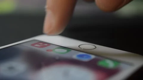 Iphone unlock. young man unlock iphone screen with touch id. Stock Footage 263138421