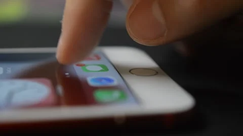 Iphone unlock. young man unlock iphone screen with touch id. Stock Footage 263138430