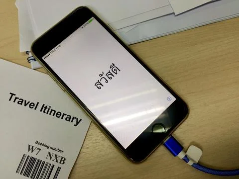 IPhone user restore the iOS on their iPhone. Stock Photos