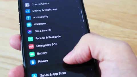 IPhone user scrolls and browses the settings Stock Footage 141319113