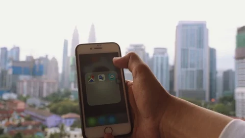 IPhone user using gps navigation application, Waze Stock Footage 104196144
