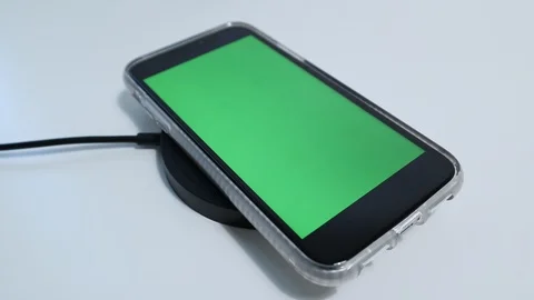 IPhone Wireless Charger with Greenscreen iPhone Placed into Frame Stock-Footage 127726991