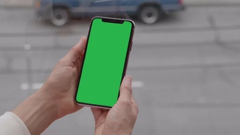 IPhone X Apple Smartphone Green Chroma Screen and Womans Hands Mobile Phone Video stock 94426813