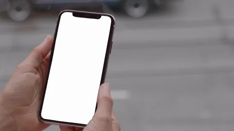 IPhone X Hands Holding New Smartphone Mobile Phone Isolated Background Street Stock Footage 98962377