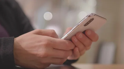 IPhone X Held in Womans Hand, Fingers Using Mobile Smartphone Internet Mobile Stock Footage 100166793