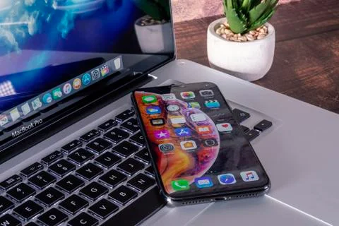 IPhone X on MacBook Pro 15 Stock Photos