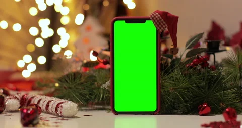 IPhone Xs max in Vertical orientation with green screen on a Christmas Stock Footage 144376172