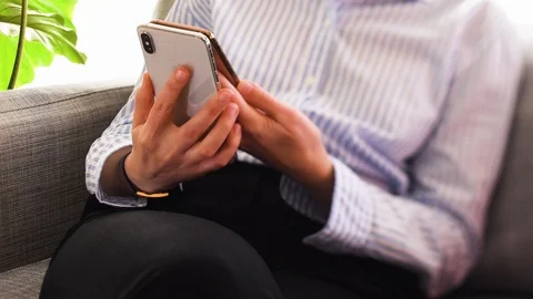 IPhone XS normal vs Max version in gold color Stock Footage 117850030