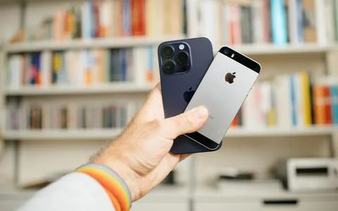 IPhones Comparison in Hand Stock Photos