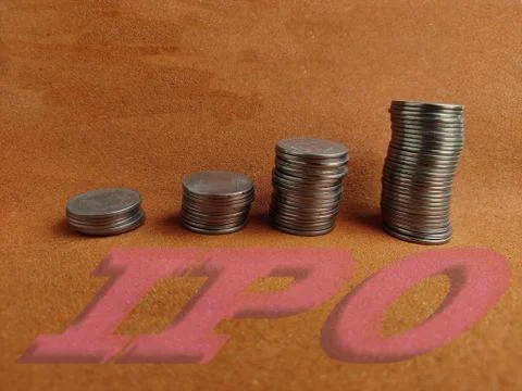 IPO initial public offering concept, stack of coins increasing on yellow Stock Photos