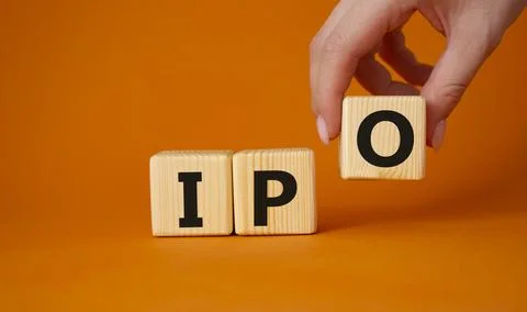IPO- Initial Public Offering symbol. Concept word IPO on wooden cubes. Busi.. Stock Photos