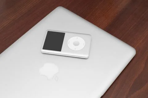 Ipod classic 160 gb on silver macbook Stock Photos