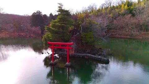 Ippeki Lake, Backlit Torii Gate, Sunset, Silhouette, Aerial│Dramatic Stock Footage 329057357